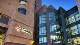 exterior photo of Grady Memorial Hospital at dusk